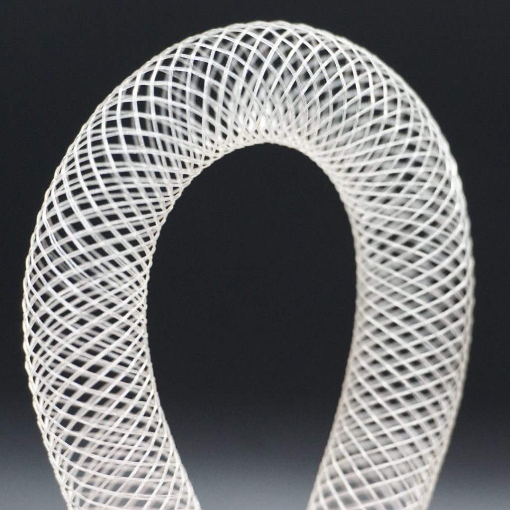 Bioabsorbable polymer braid looped with a black background