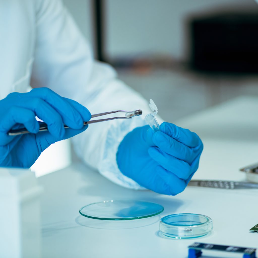 Lab technician adjusting chip implants