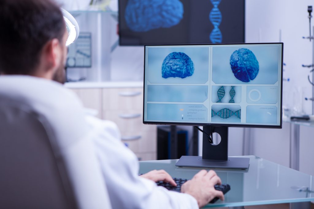 Doctor examines brain imaging scan