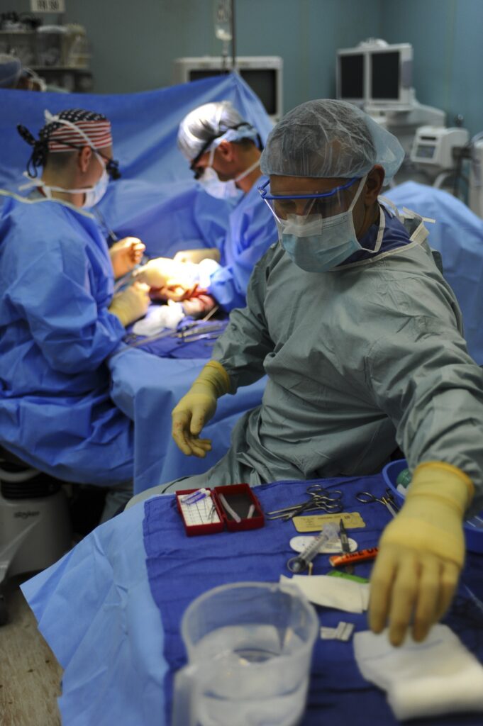 Surgeons operating on patient