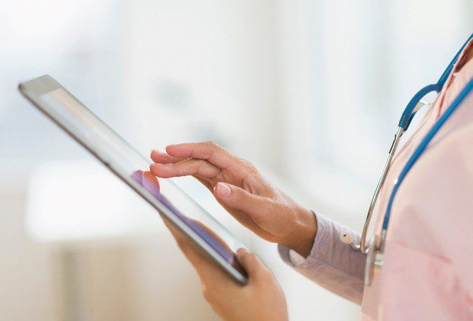 Medical professional using tablet