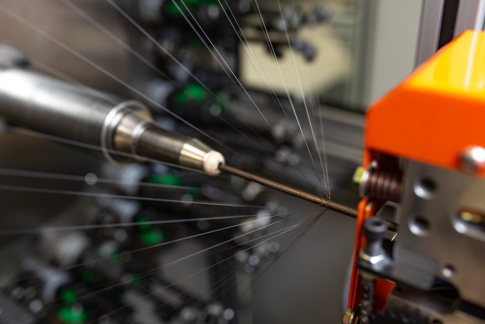 Nitinol braid being manufactured