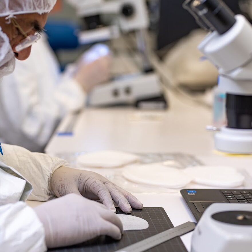 Technician creating medical device prototype